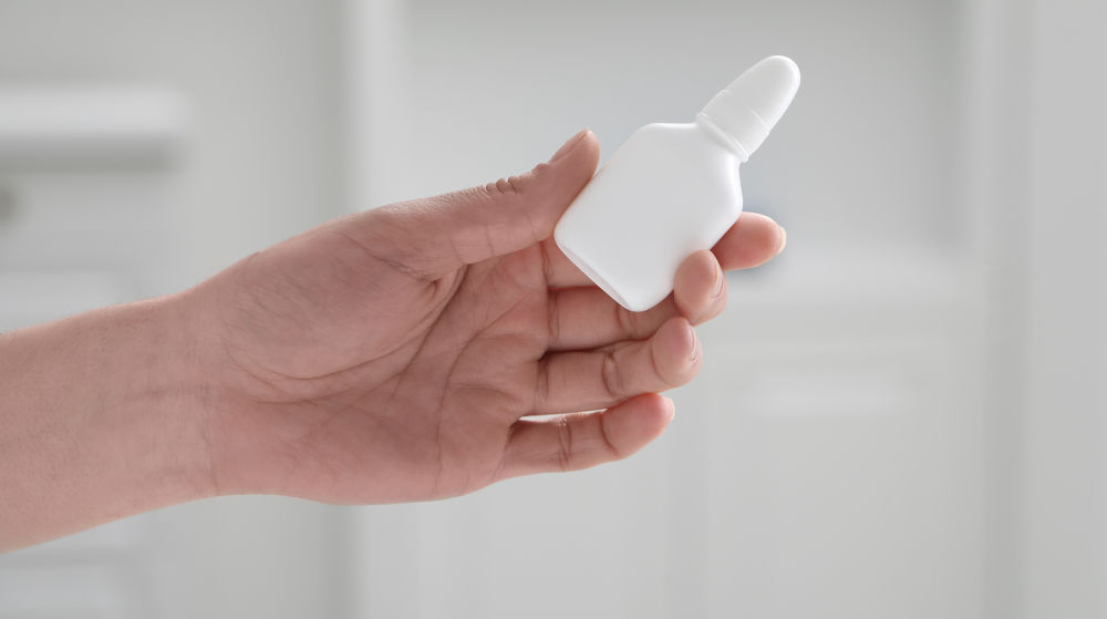 Saline spray used during rhinoplasty recovery to keep the nose moist and soften crusting