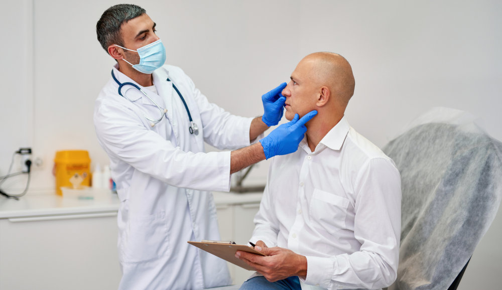 Rhinoplasty Consultation in Toronto – Discussing Nose Surgery Options Man consulting with a plastic surgeon about rhinoplasty in Toronto
