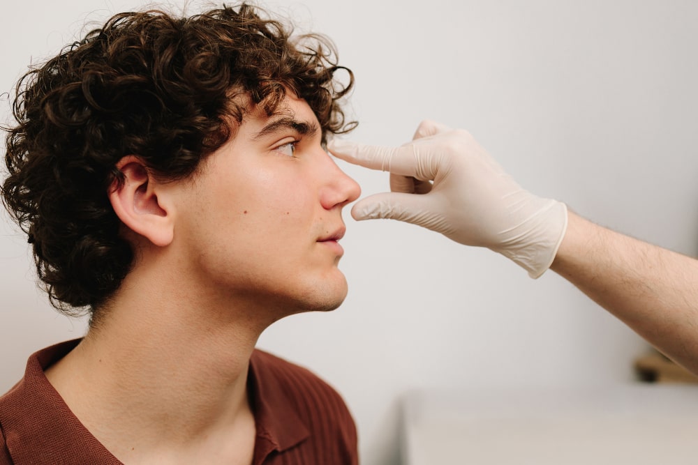 Rhinoplasty procedure to reshape the nose, improve symmetry, and refine overall nasal appearance.